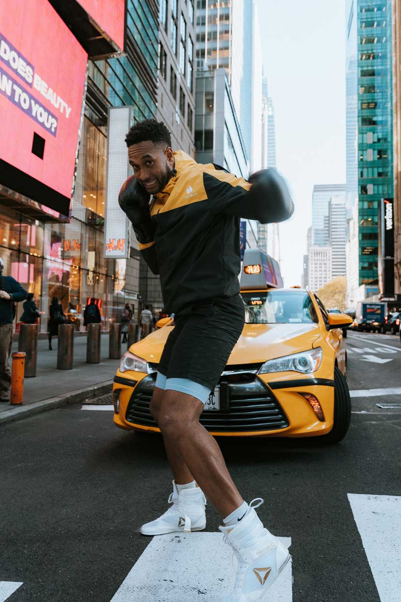 coach boxing in the city in front of an nyc taxi